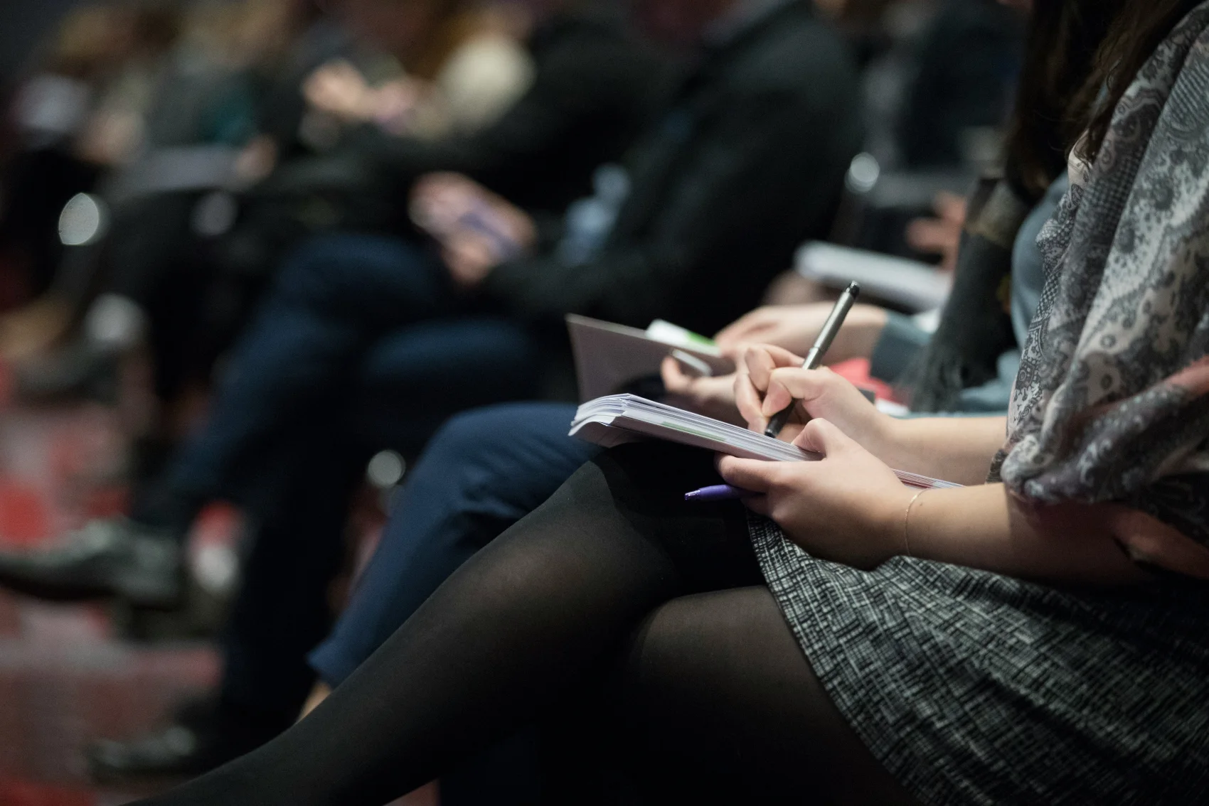 Workshop attendees taking notes during a training session